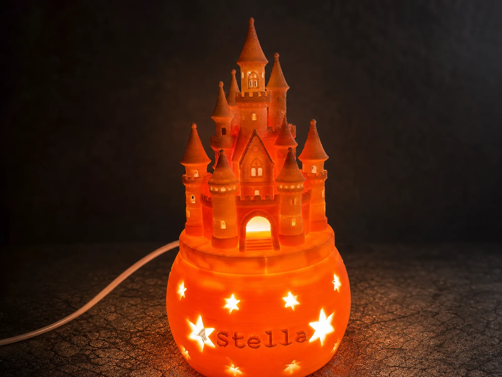 Orange leuchtendes personalisiertes 3D-Druck-Schloss mit dem Namen Stella